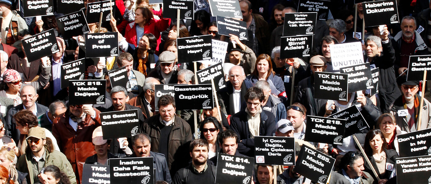 How many journalists are behind bars in Turkey?
