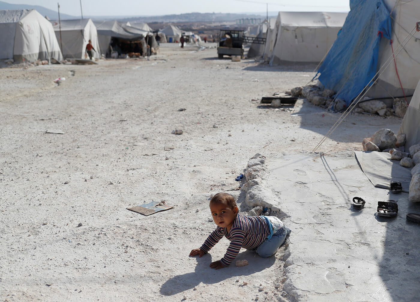 Hundreds of women and children affiliated with ISIS escape from Ain Issa camp in northern Syria during the Turkish offensive