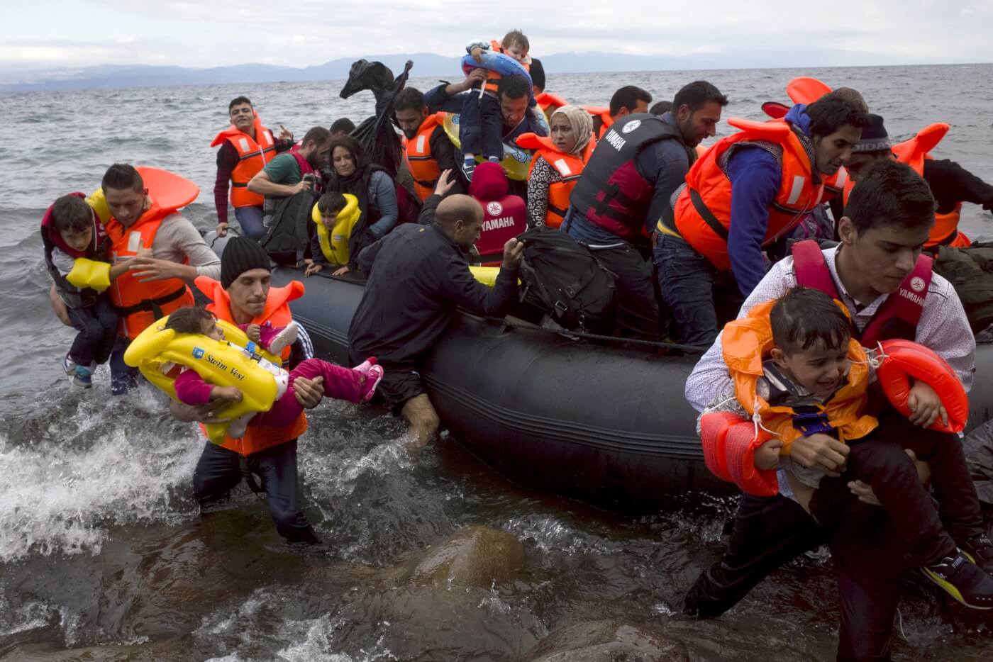 Greek soldiers fire tear gas to prevent thousands of people crossing the border from Turkey